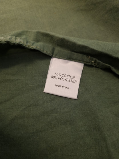 Grønt stoff 50/50 bomull og polyester.