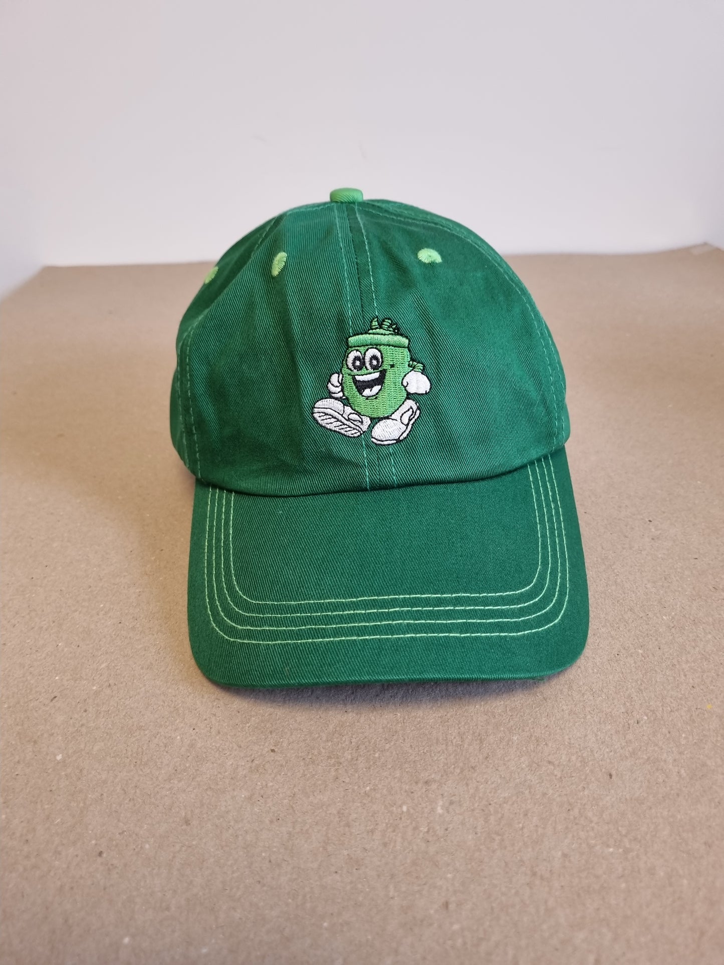 Grønn caps fra Kiwi
