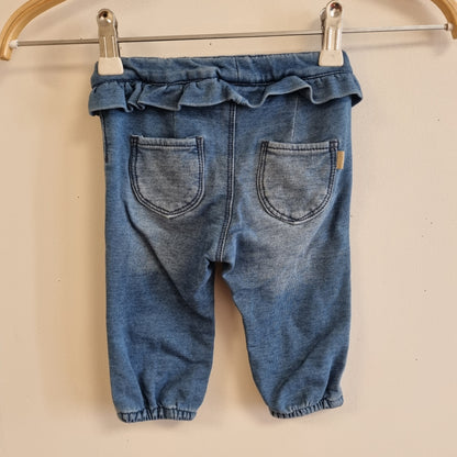 Blå bukse med volang - 68