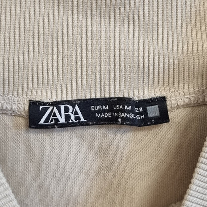 Beige topp med høy hals - M